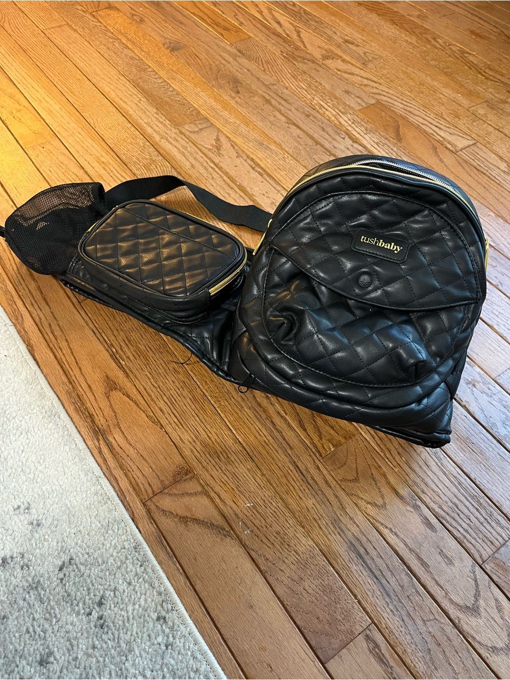 Tushbaby black quilted faux leather hip seat carrier